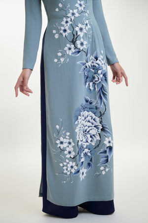 Close-up of intricate floral hand-painted details on grey silk Ao Dai.