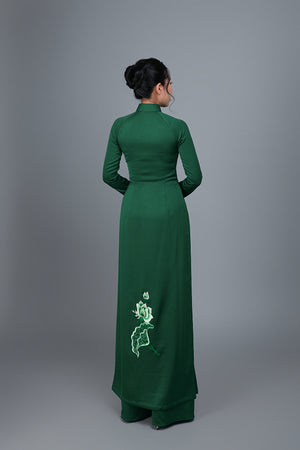 Women's ao dai dress Vietnamese traditional long dress. High quality green colored fabric with embroidered, lotus motif.