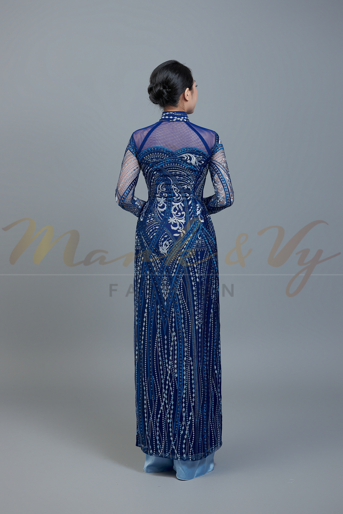 Custom Ao Dai featuring stunning lace over dark blue color chiffon lining