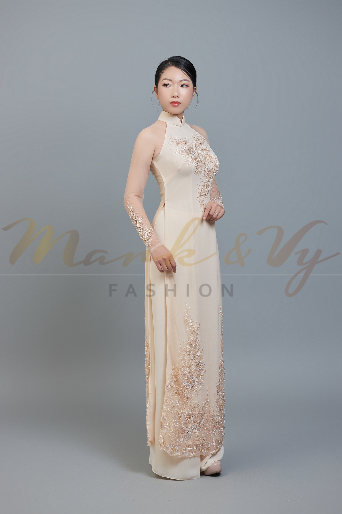 Wedding ao dai in champagne color lace & chiffon fabric. Features beautiful hand beading.