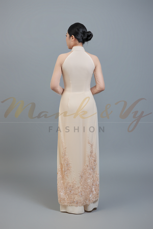Wedding ao dai in champagne color lace & chiffon fabric. Features beautiful hand beading.
