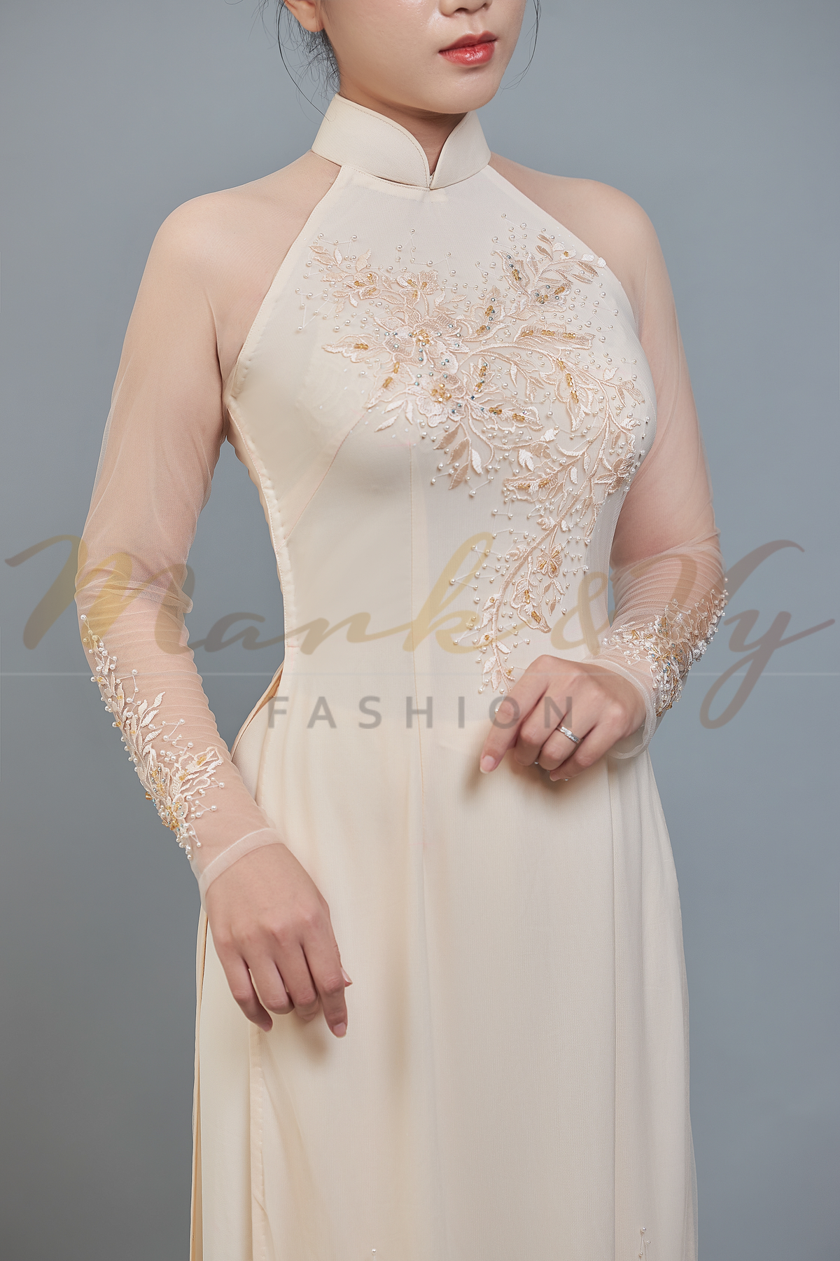Wedding ao dai in champagne color lace & chiffon fabric. Features beautiful hand beading.