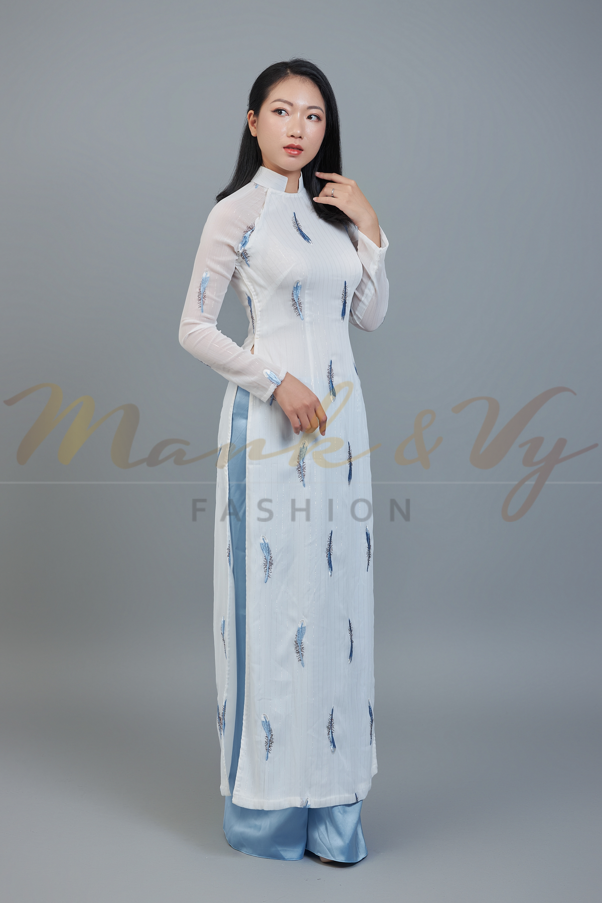 Custom Ao Dai featuring stunning sheer fabric over white chiffon