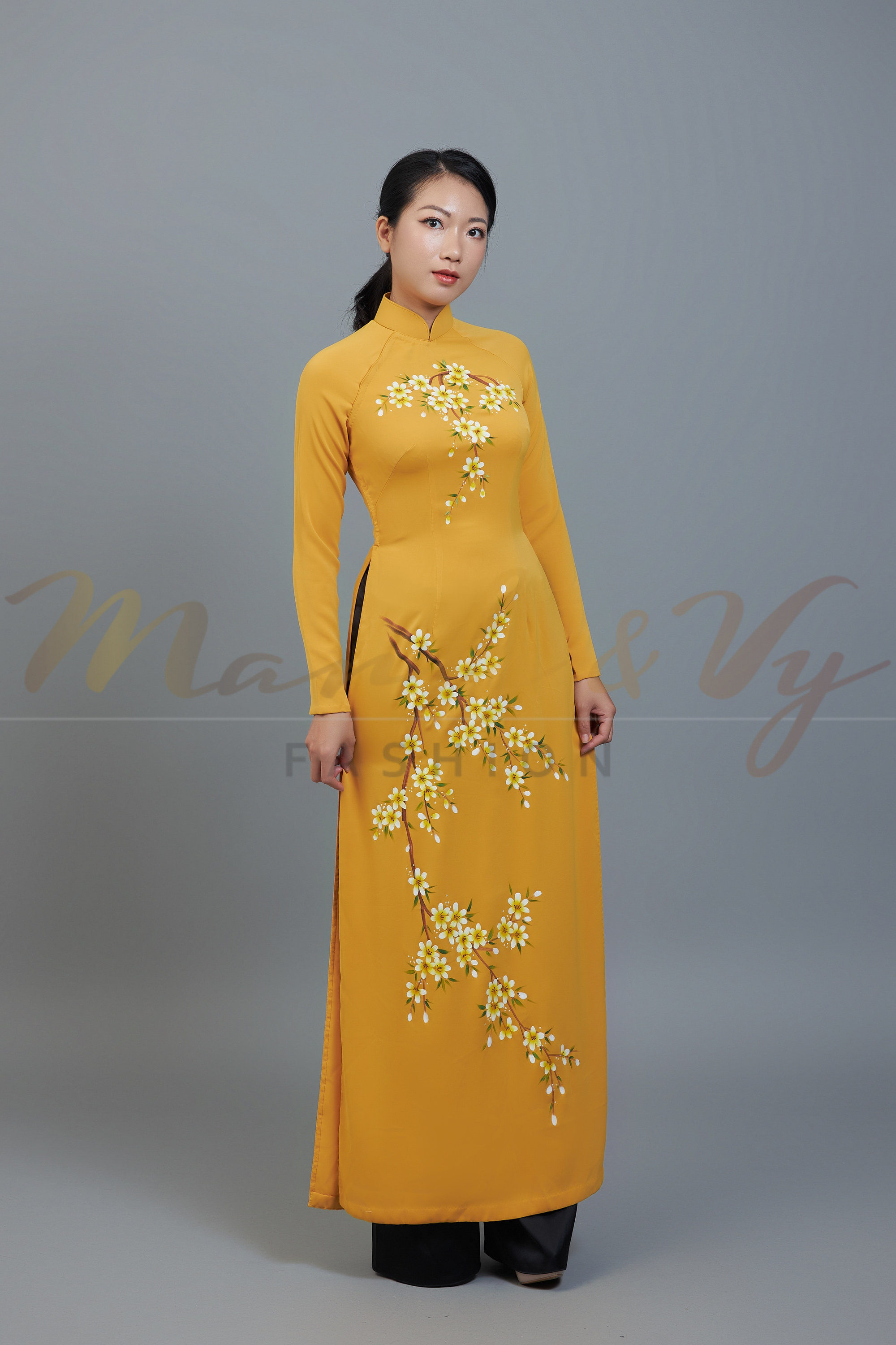 Custom made ao dai. Unique, hand-painted, floral motif on dark yellow fabric.
