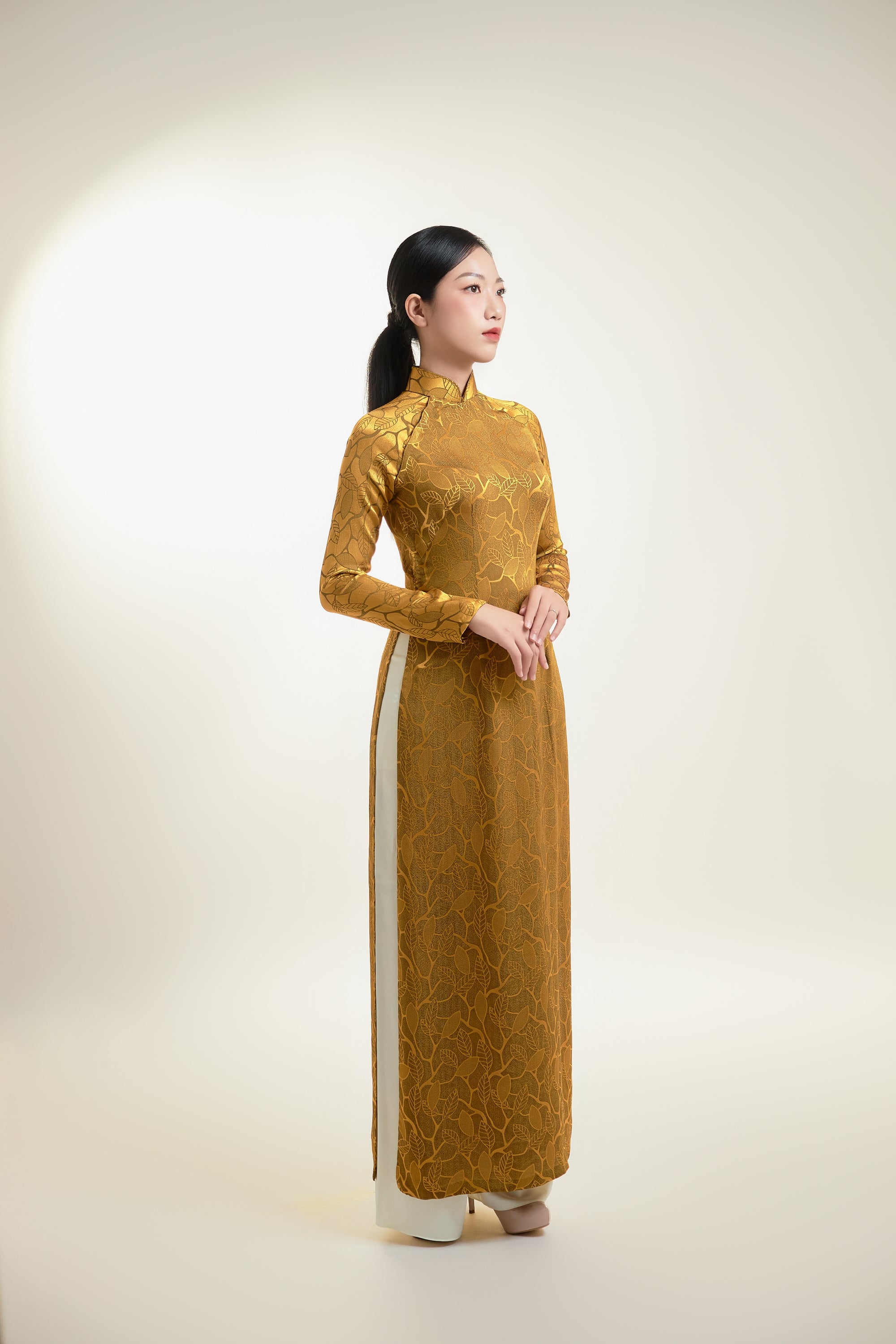 Thai Tuan Silk Brocade Ao Dai in Gold with Leaf Pattern