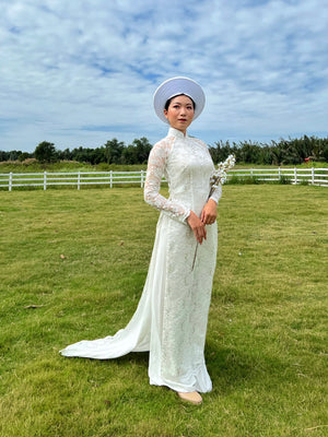 Wedding ao dai. Vietnamese long dress in spectacular white lace.