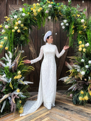 Wedding ao dai. Vietnamese long dress in spectacular white lace.