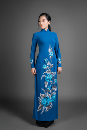 Ao dai Vietnam traditional dress. Blue silk long dress with stunning embroidered rose motif.