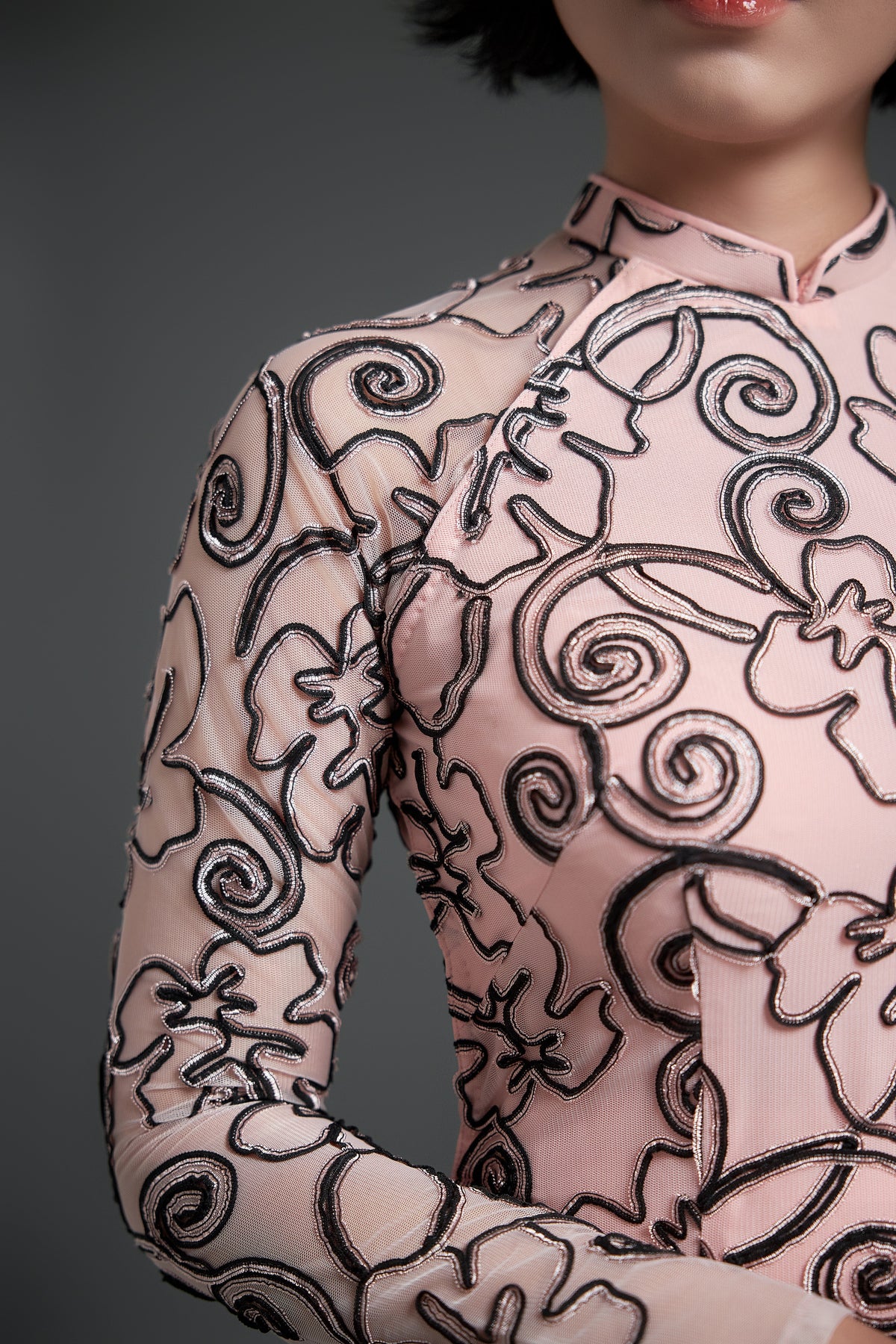 Black-Patterned Elegance on Pink Lace