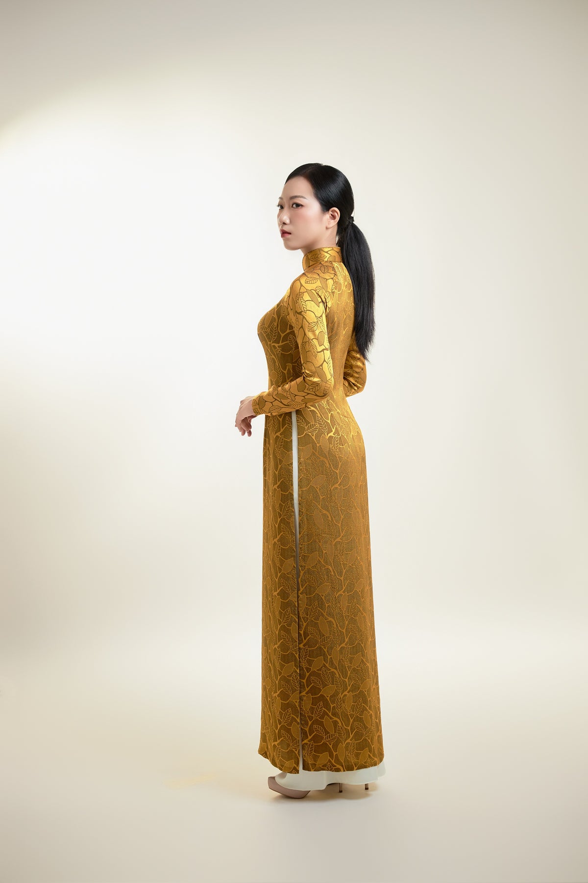 Thai Tuan Silk Brocade Ao Dai in Gold with Leaf Pattern