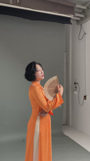 Thai Tuan Silk Brocade Ao Dai in Orange with Leaf Pattern
