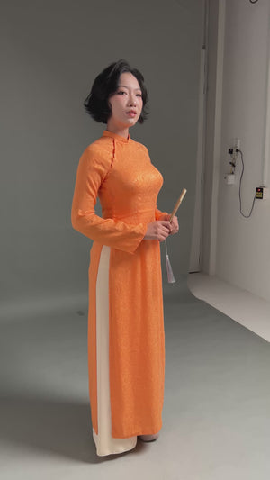 Thai Tuan Silk Brocade Ao Dai in Orange with Leaf Pattern