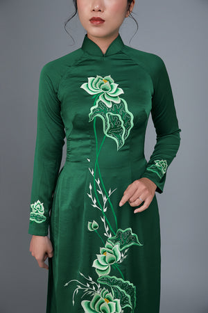 Women's ao dai dress Vietnamese traditional long dress. High quality green colored fabric with embroidered, lotus motif.