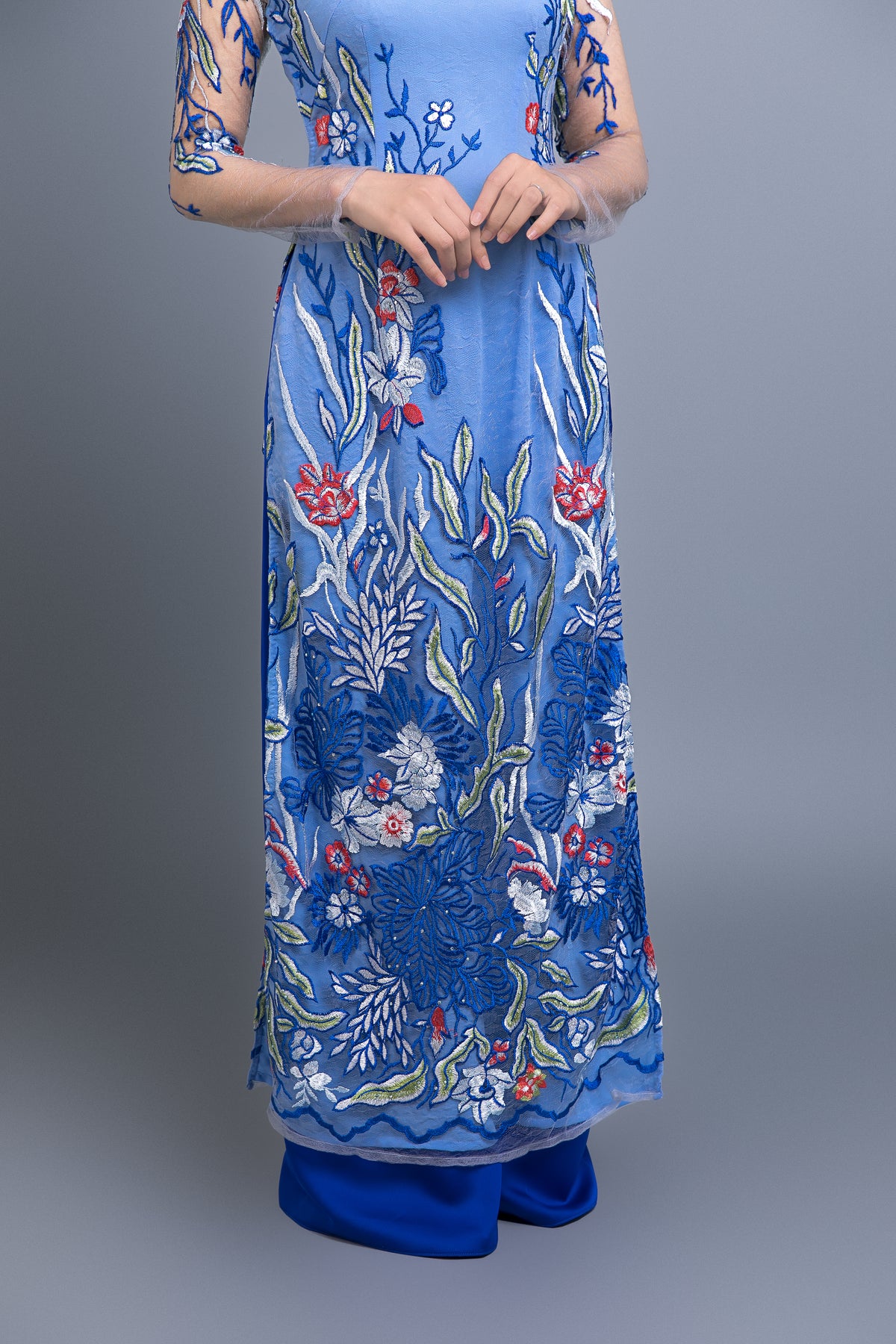 Custom Ao Dai. Multicolored, floral motif lace over light blue, chiffon fabric.