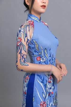 Custom Ao Dai. Multicolored, floral motif lace over light blue, chiffon fabric.
