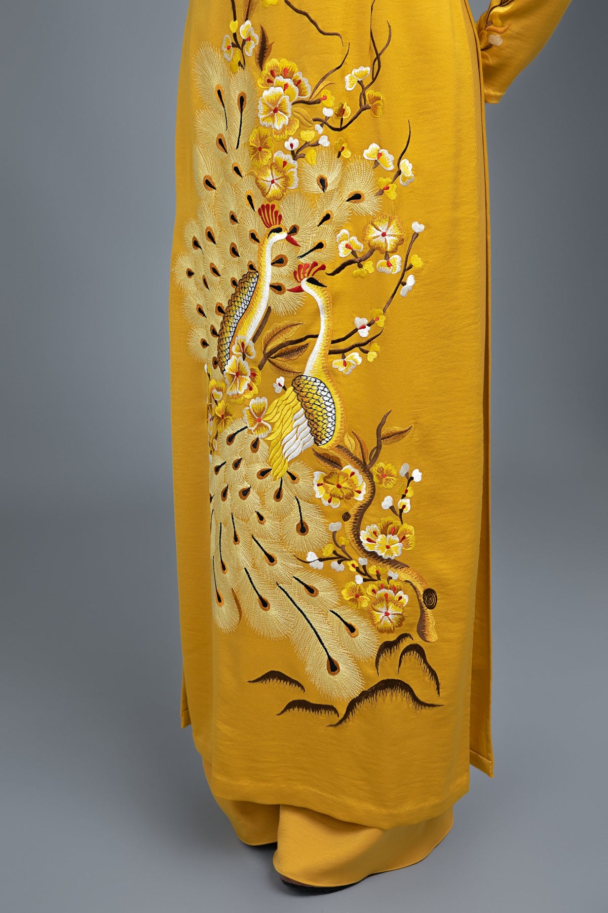Custom made Vietnamese ao dai dress in yellow with embroidered, peacock motif