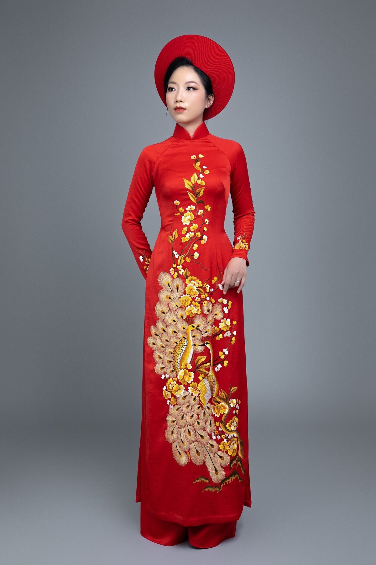 Custom made Vietnamese ao dai dress in red with embroidered, peacock motif