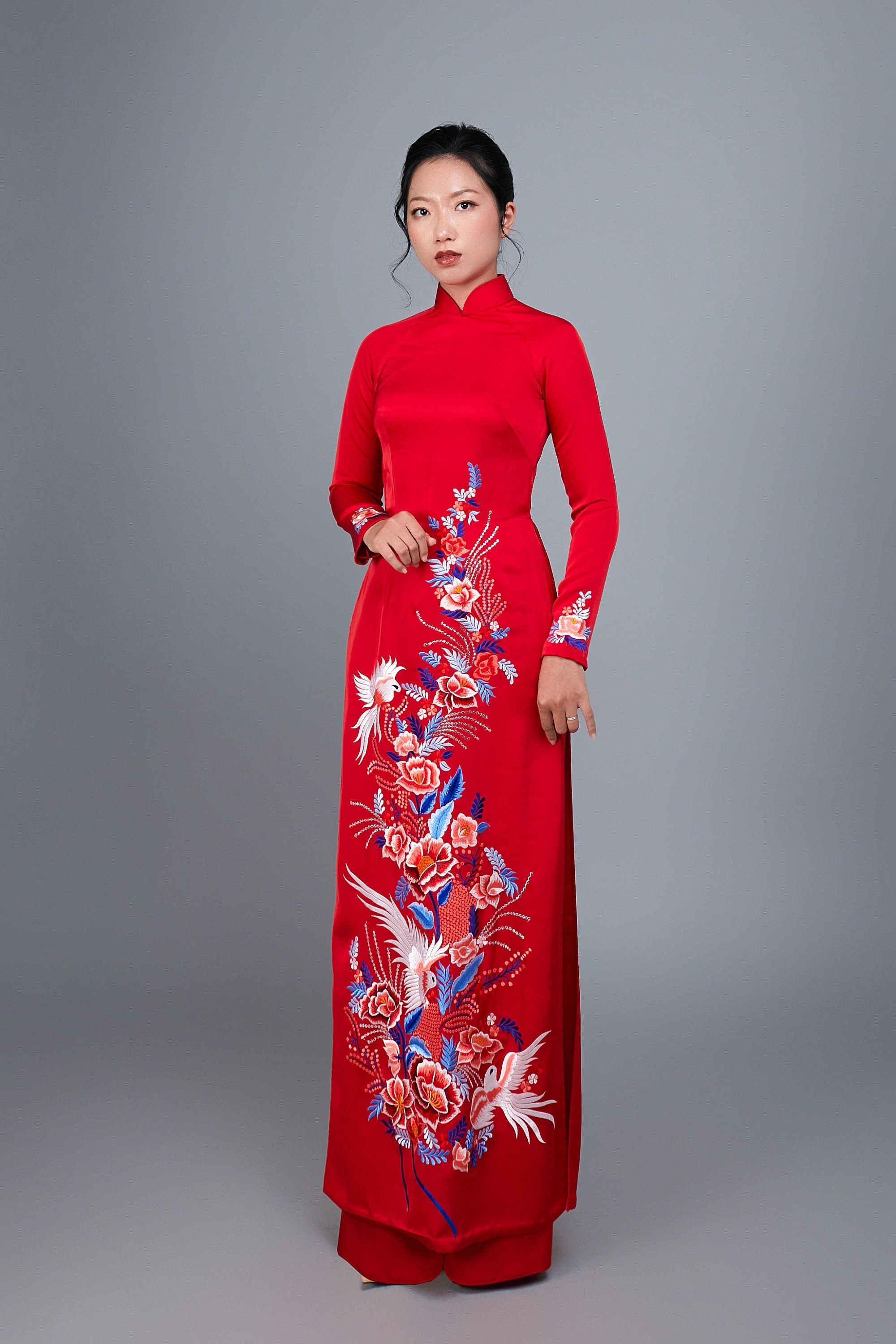 Women's ao dai dress Vietnamese traditional long dress. High quality red silk fabric with embroidered flower motif