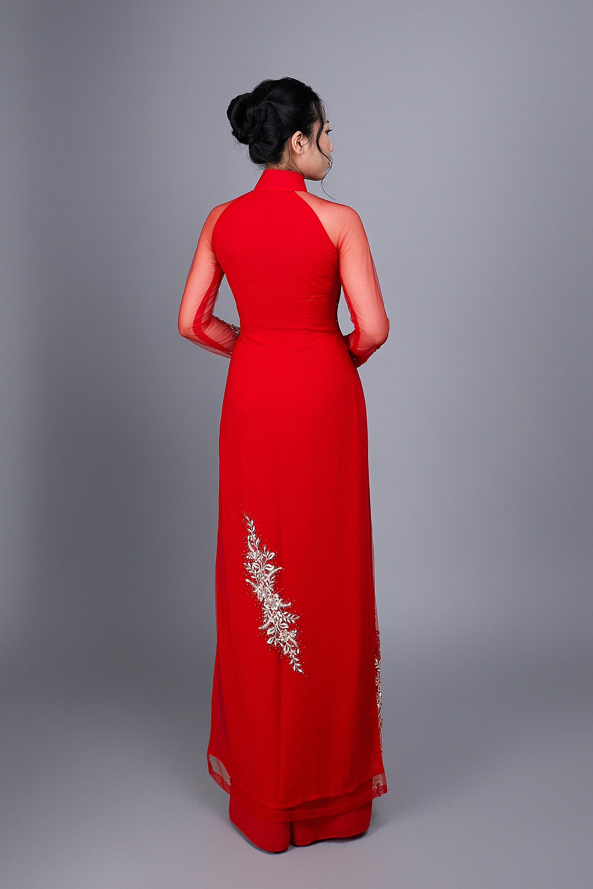Wedding ao dai in red chiffon fabric. Features beautiful hand beading