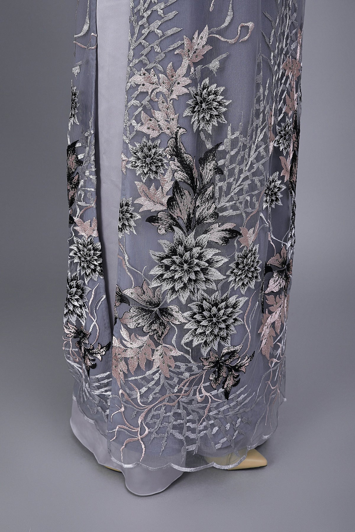 Custom Ao Dai. Floral motif lace over gray chiffon fabric.