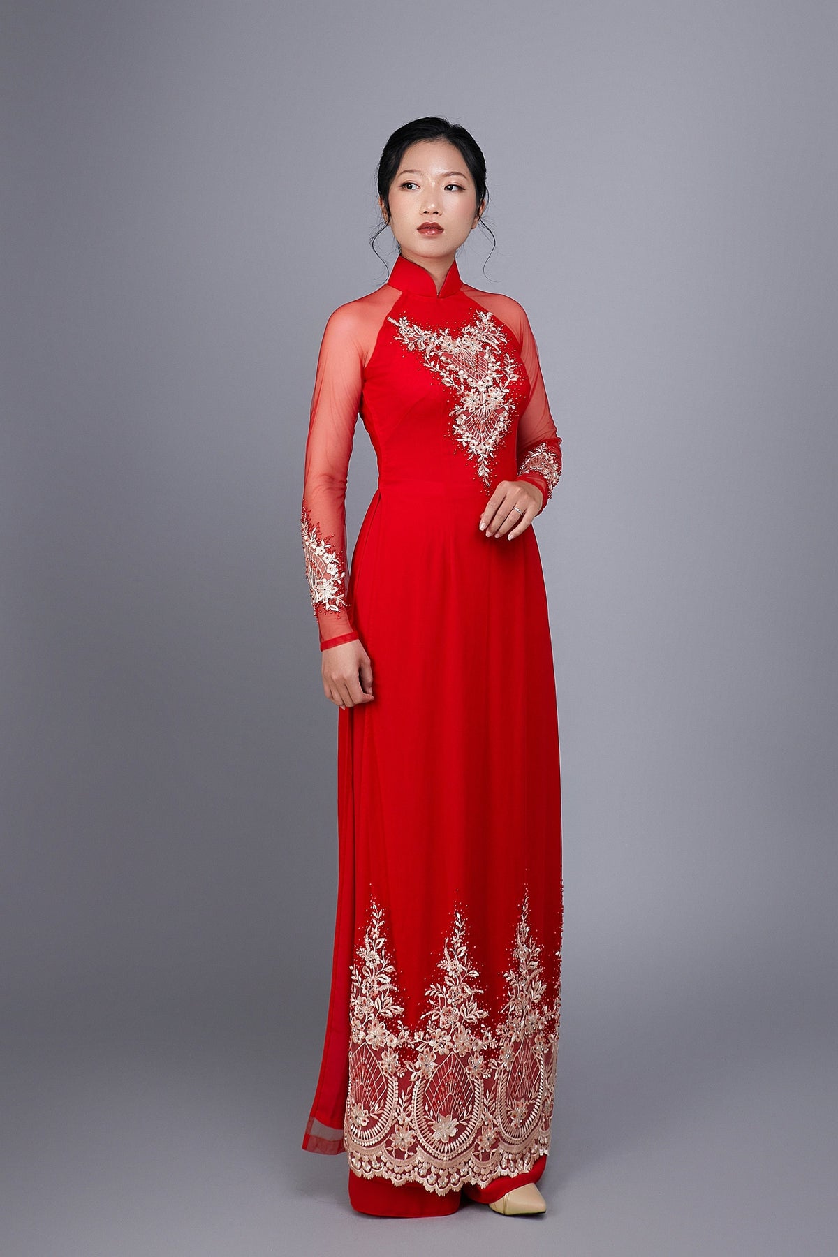 Wedding ao dai in red chiffon fabric. Features beautiful hand beading.